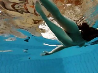 Brunette Kristy Stripping Underwater